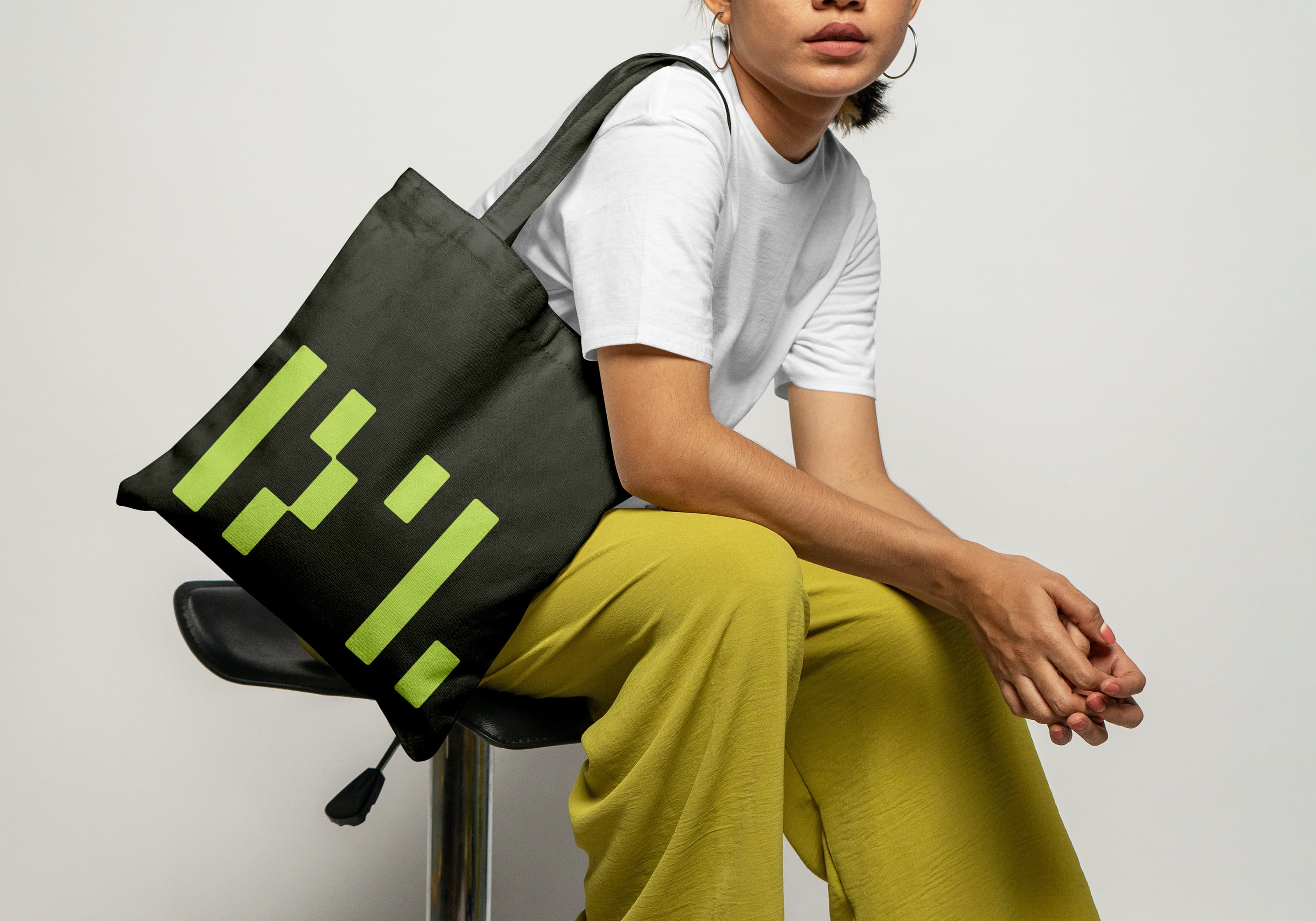 Person carrying a bag with an old brand mark